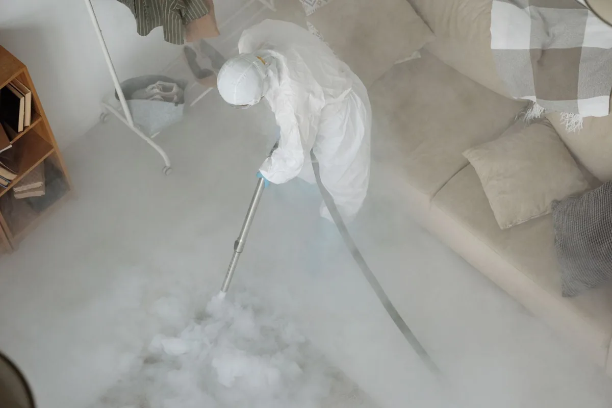 Biohazard cleanup technician in protective equipment, Beecher, MI